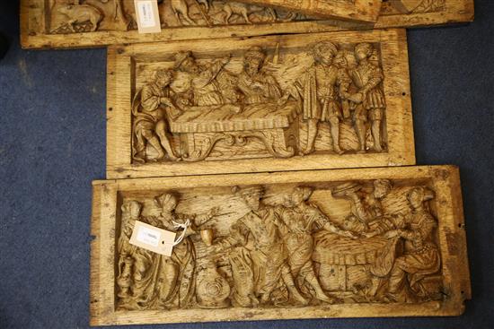 A set of five 16th century Flemish relief carved oak panels, largest 8.25 x 27in.